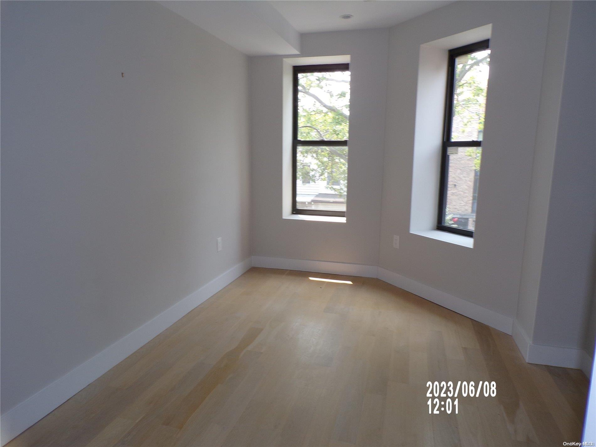 695 Monroe Street Brooklyn, NY 11221 - Photo 8 of 23 an empty room with a window
