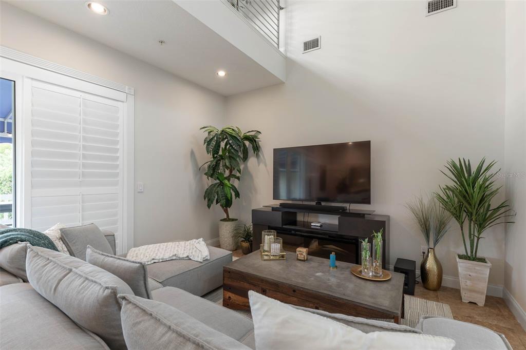 4642 Riverwalk Village Court Ponce Inlet, FL 32127 - Photo 12 of 98 a living room with furniture and a flat screen tv