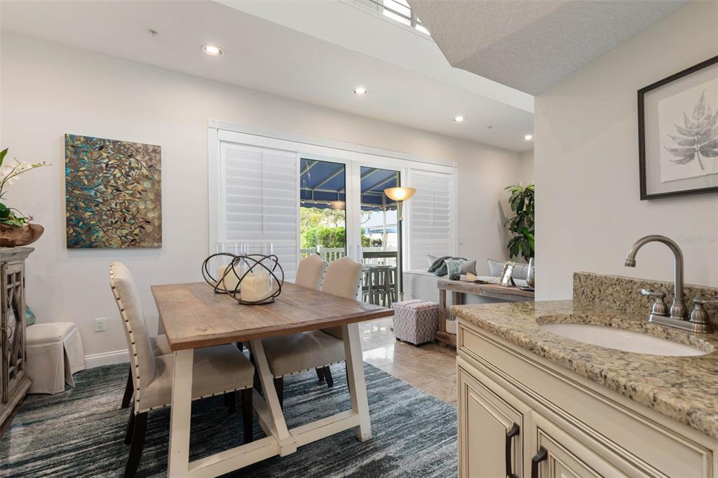 4642 Riverwalk Village Court Ponce Inlet, FL 32127 - Photo 17 of 98 a dining room with furniture and window