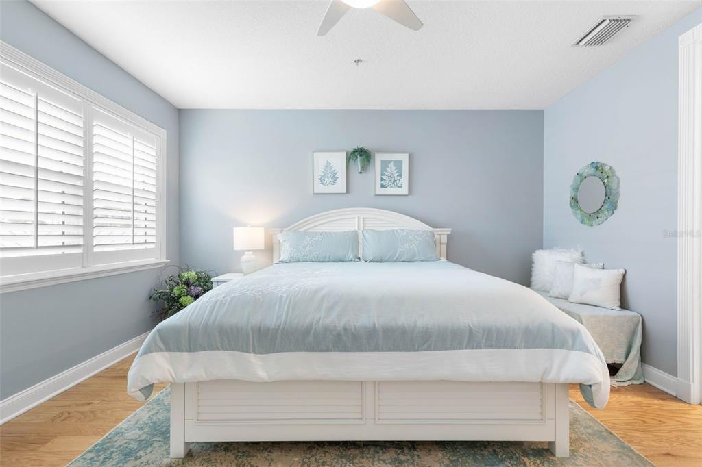 4642 Riverwalk Village Court Ponce Inlet, FL 32127 - Photo 43 of 98 a bedroom with a bed and window