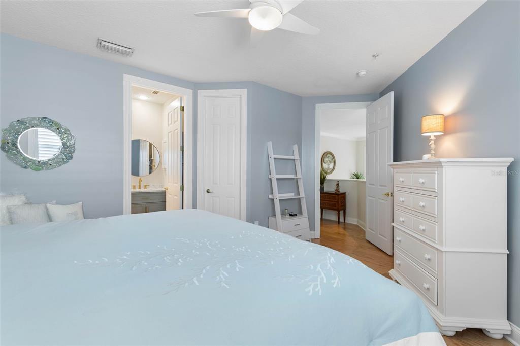 4642 Riverwalk Village Court Ponce Inlet, FL 32127 - Photo 45 of 98 a bedroom with a bed and a dresser