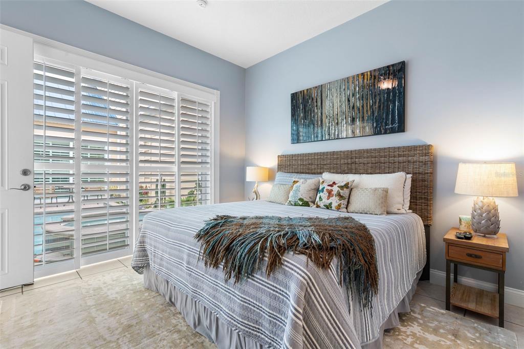 4642 Riverwalk Village Court Ponce Inlet, FL 32127 - Photo 50 of 98 a bedroom with a bed and a window