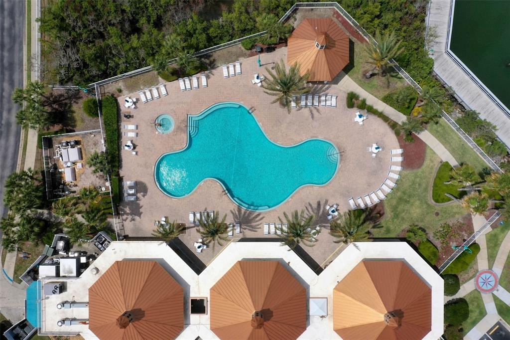 4642 Riverwalk Village Court Ponce Inlet, FL 32127 - Photo 79 of 98 an aerial view of a swimming pool patio and outdoor seating