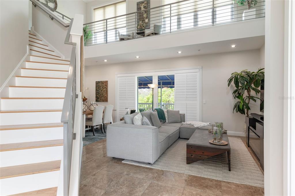 4642 Riverwalk Village Court Ponce Inlet, FL 32127 - Photo 10 of 98 a living room with furniture and a potted plant
