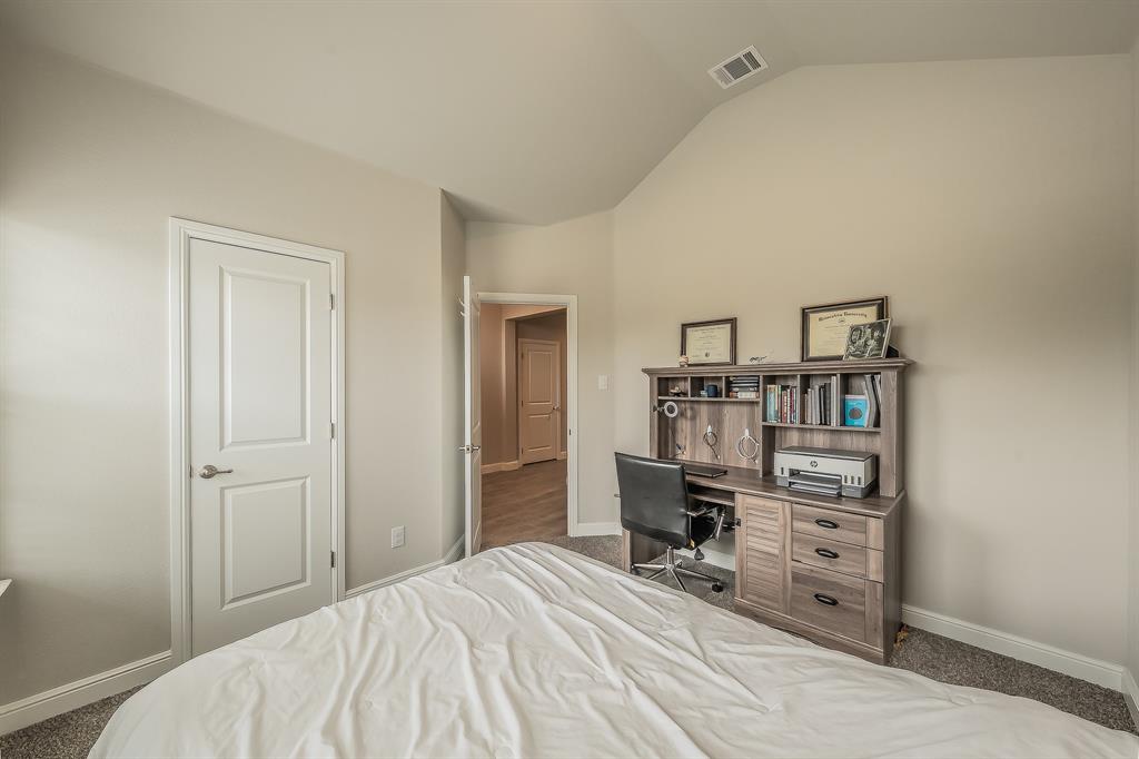 1212 Bosque Lane Weatherford, TX 76087 - Photo 19 of 38 a room that has a bed and a chair in it