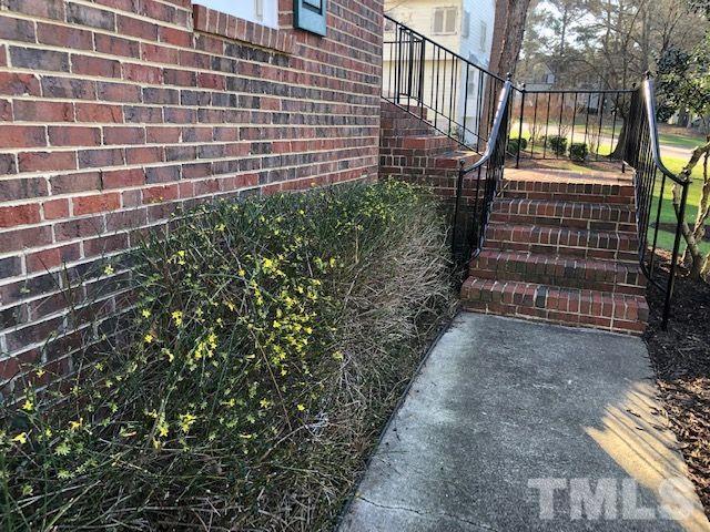 409 Guy Walker Way Durham, NC 27703 - Photo 2 of 47 a view of a pathway with a street side of the building