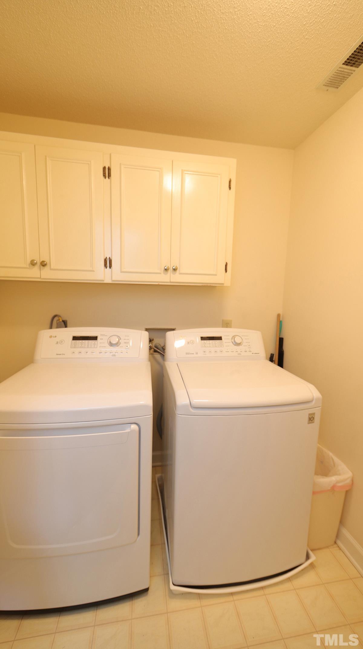 409 Guy Walker Way Durham, NC 27703 - Photo 27 of 47 a utility room with dryer and washer