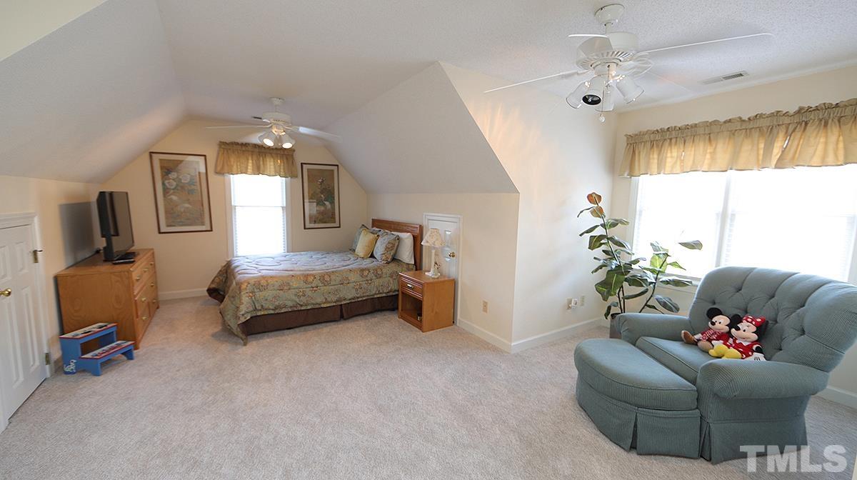 409 Guy Walker Way Durham, NC 27703 - Photo 28 of 47 a bedroom with furniture and a window