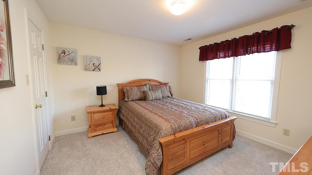 409 Guy Walker Way Durham, NC 27703 - Photo 29 of 47 a bedroom with a bed and window