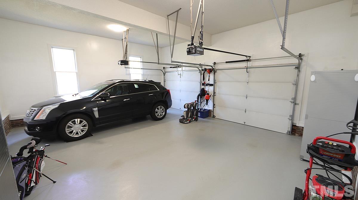 409 Guy Walker Way Durham, NC 27703 - Photo 34 of 47 a view of a garage with a white car parked