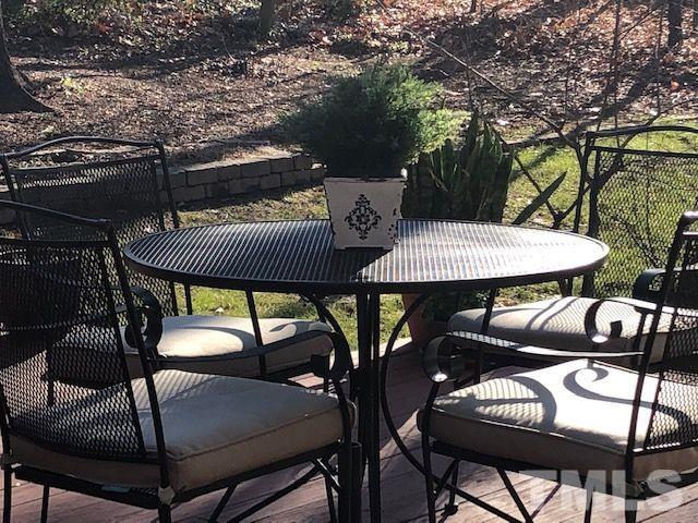 409 Guy Walker Way Durham, NC 27703 - Photo 36 of 47 a view of a patio with a table and chairs
