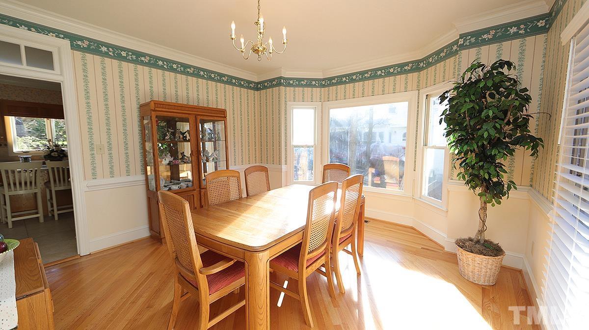 409 Guy Walker Way Durham, NC 27703 - Photo 4 of 47 a view of a dining room with furniture window and wooden floor