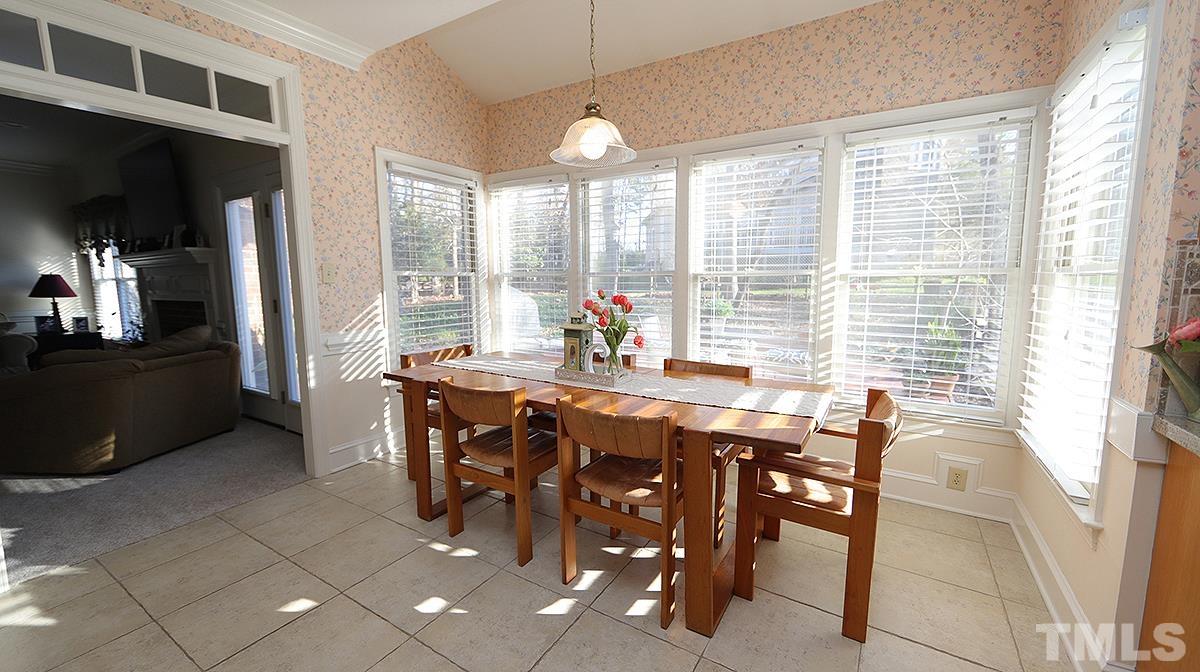 409 Guy Walker Way Durham, NC 27703 - Photo 8 of 47 a view of a dining room with furniture and chandelier