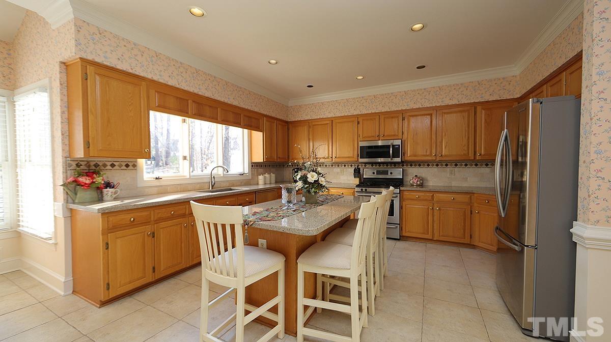 409 Guy Walker Way Durham, NC 27703 - Photo 9 of 47 a kitchen with appliances a sink and cabinets