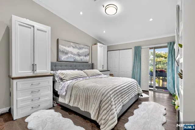 a bedroom with a bed and with furniture