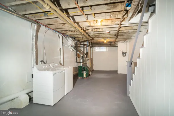 a view of a storage & utility room with racks