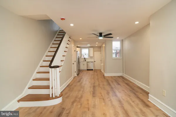 an entryway in a hall with a window