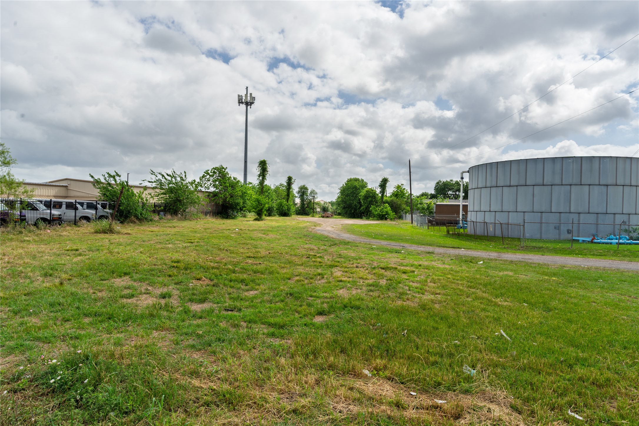 0 Shaver Street Pasadena, TX 77502 - Photo 5 of 6 a view of a garden with a building in the background