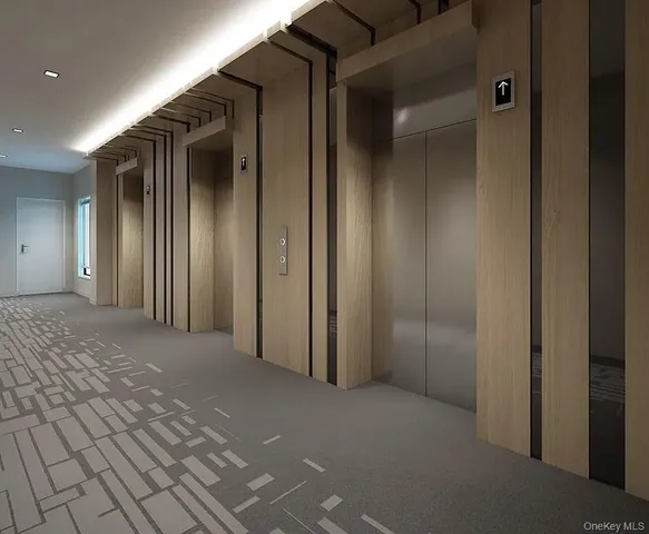 an empty room with closet and a bathroom