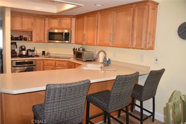 a kitchen with a sink cabinets and appliances