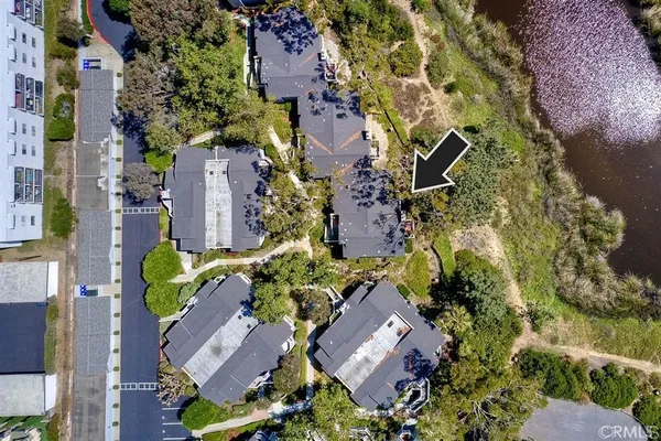 an aerial view of residential house with outdoor space and parking
