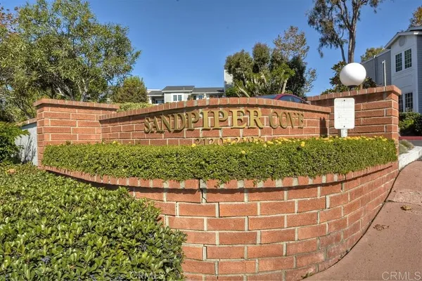 a view of a sign board with a house