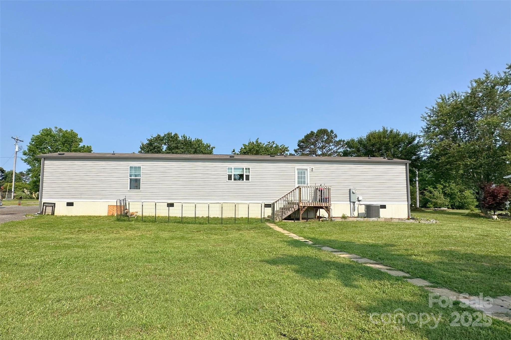 2449 Leonhart Road Cherryville, NC 28021 - Photo 15 of 21 a view of a house with a yard and sitting area