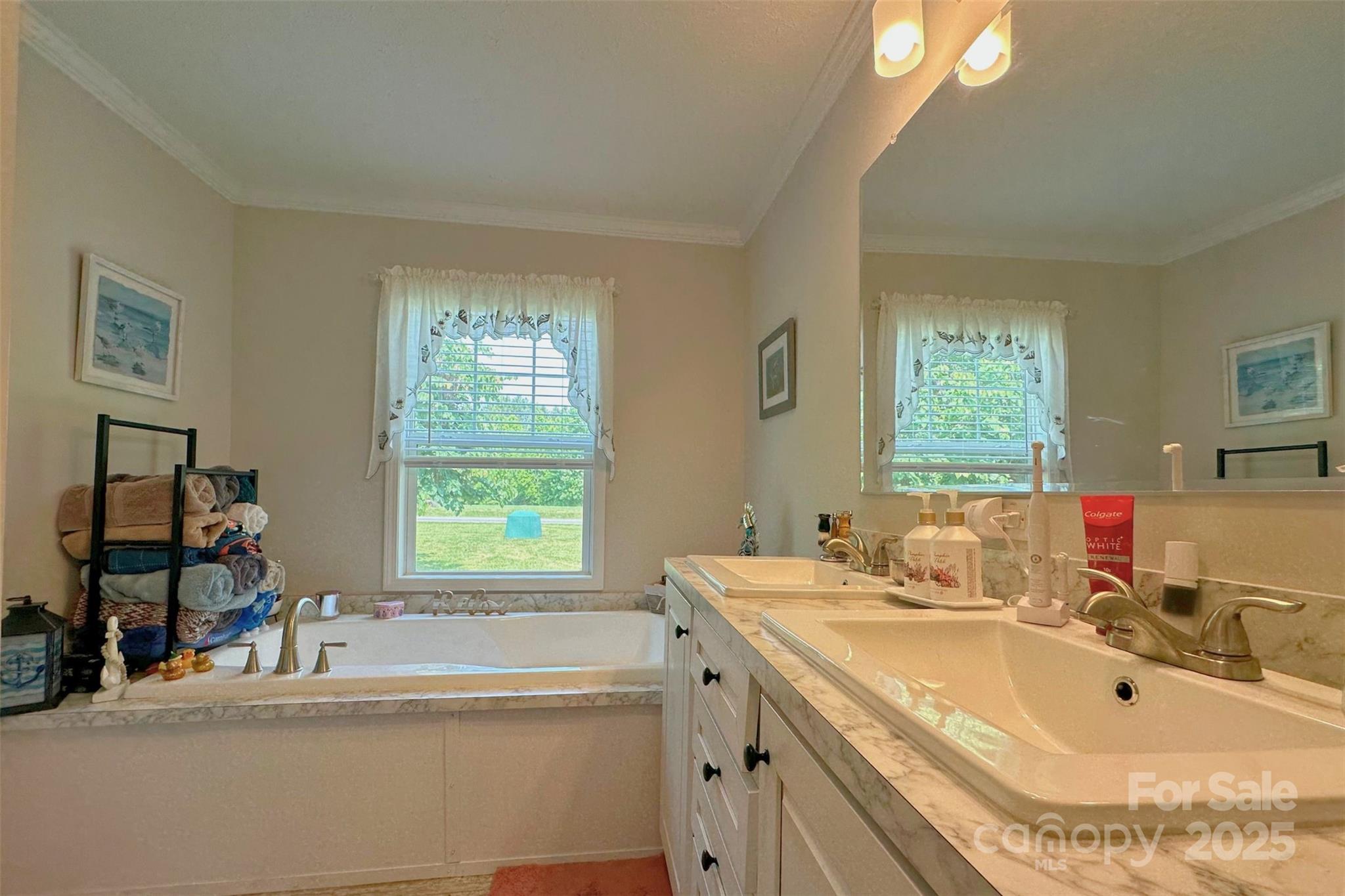 2449 Leonhart Road Cherryville, NC 28021 - Photo 8 of 21 a bathroom with a tub sink and mirror