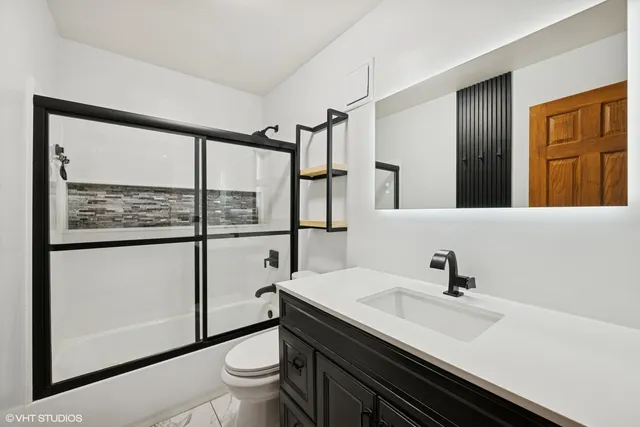 a bathroom with a sink and a mirror