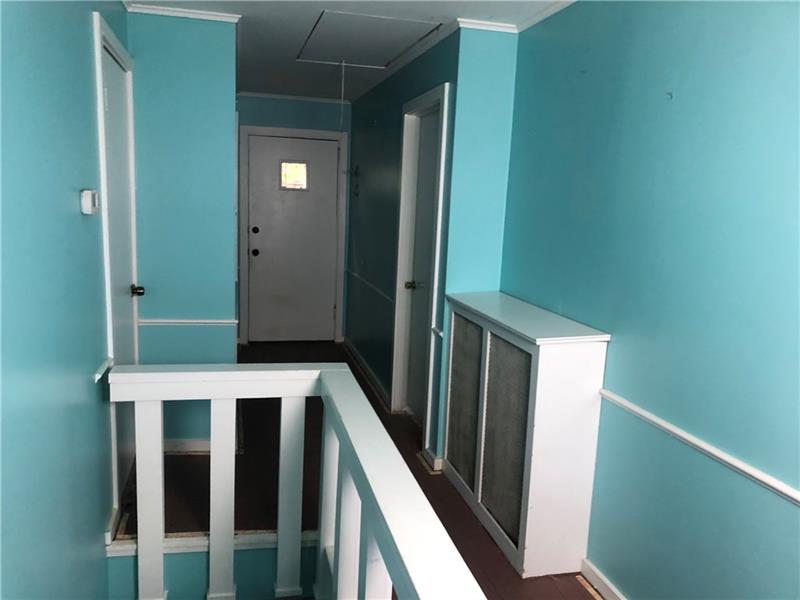 510 Agnew Road Pittsburgh, PA 15227 - Photo 15 of 25 Upstairs hallway leads out onto the decks and rear yard.