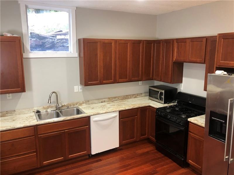 510 Agnew Road Pittsburgh, PA 15227 - Photo 8 of 25 Kitchen is bright and open. There is also ample cabinet and counter space.