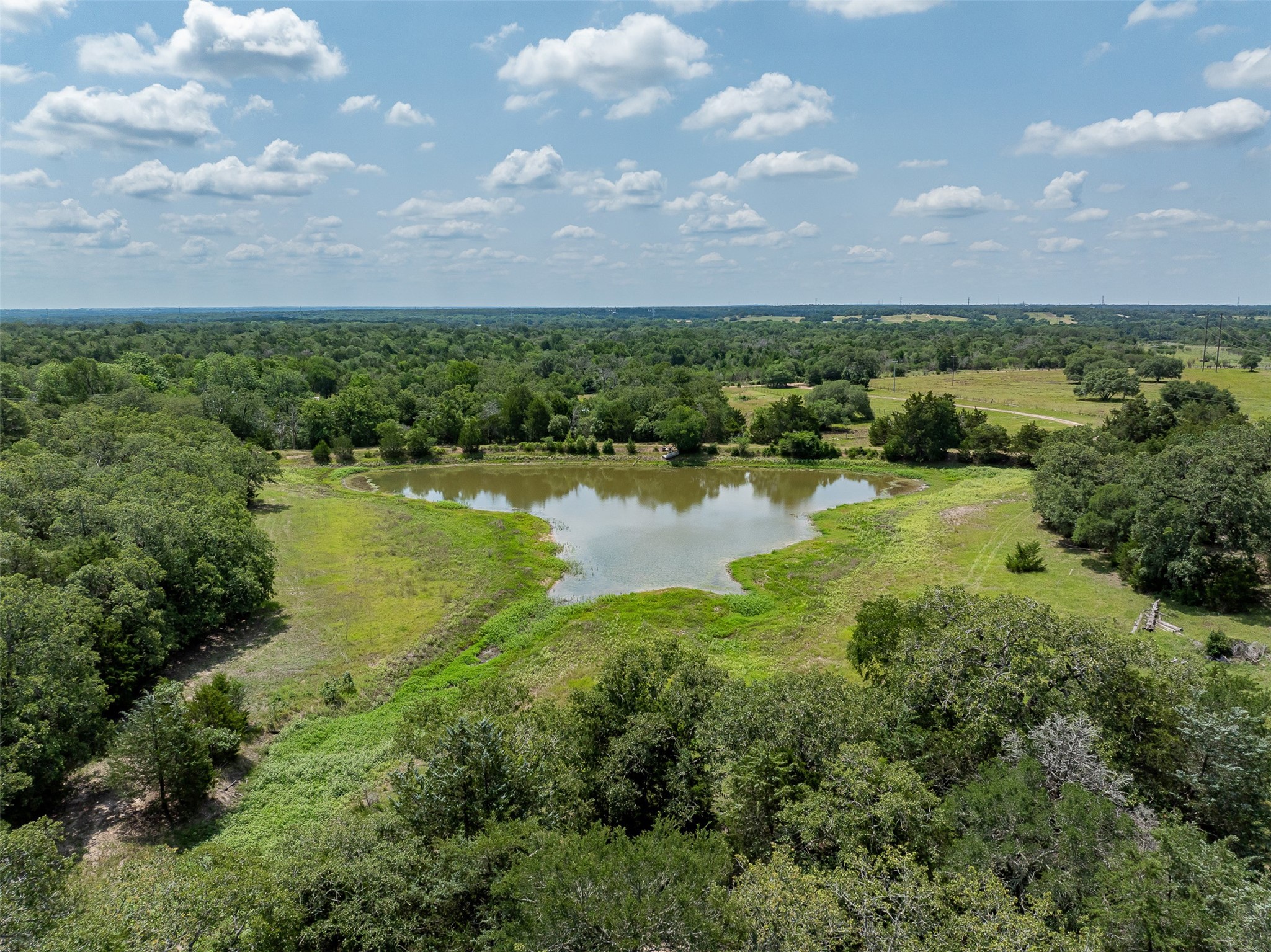 a view of a lake with houses in the back