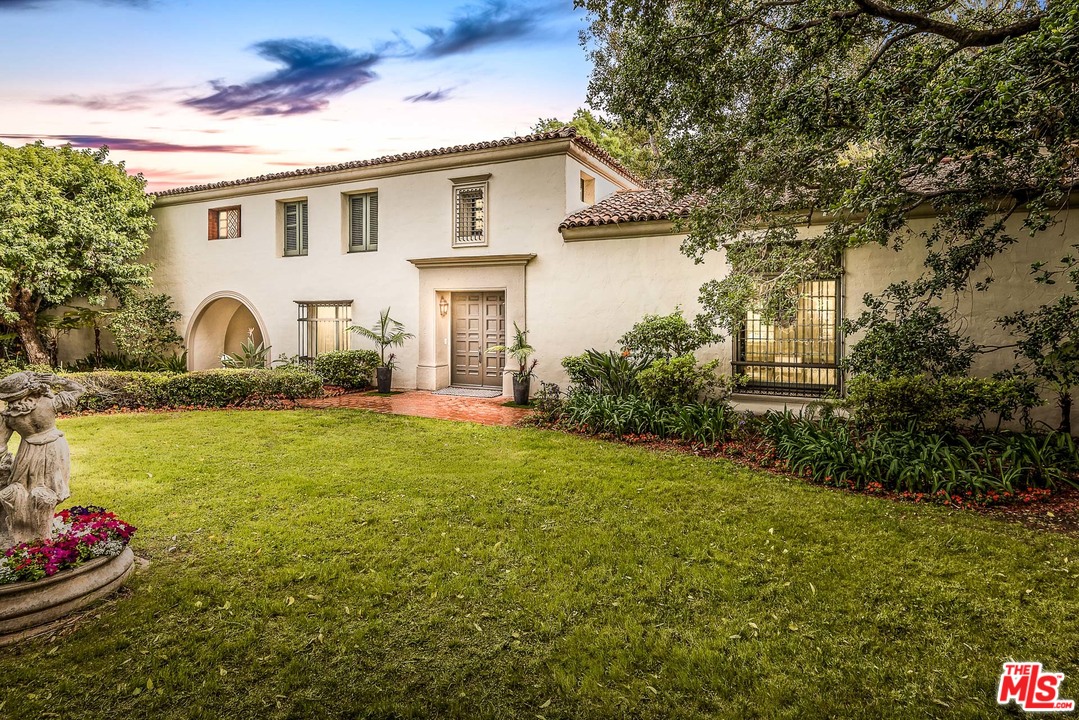 12730 Sunset Boulevard Los Angeles, CA 90049 - Photo 2 of 51 a front view of a house with a yard