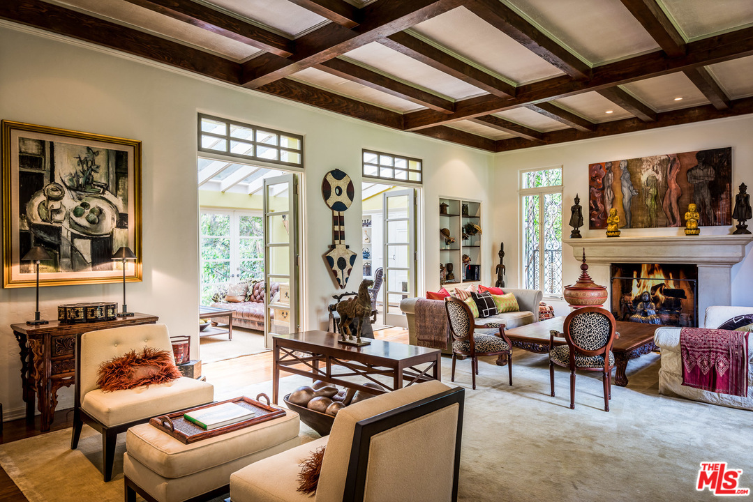 12730 Sunset Boulevard Los Angeles, CA 90049 - Photo 12 of 51 a living room with furniture windows and a fireplace