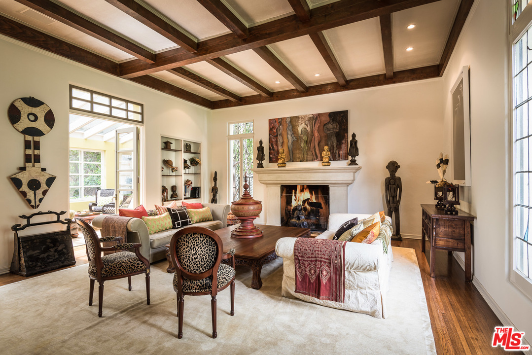 12730 Sunset Boulevard Los Angeles, CA 90049 - Photo 14 of 51 a living room with furniture a fireplace and a table