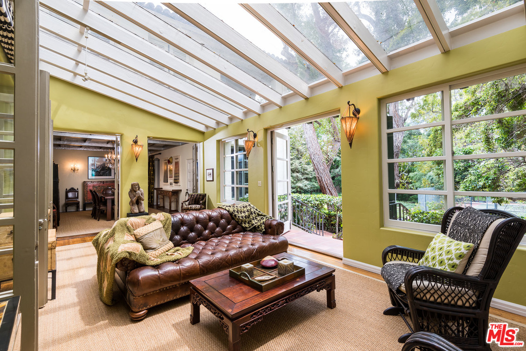 12730 Sunset Boulevard Los Angeles, CA 90049 - Photo 16 of 51 a living room with furniture and a large window