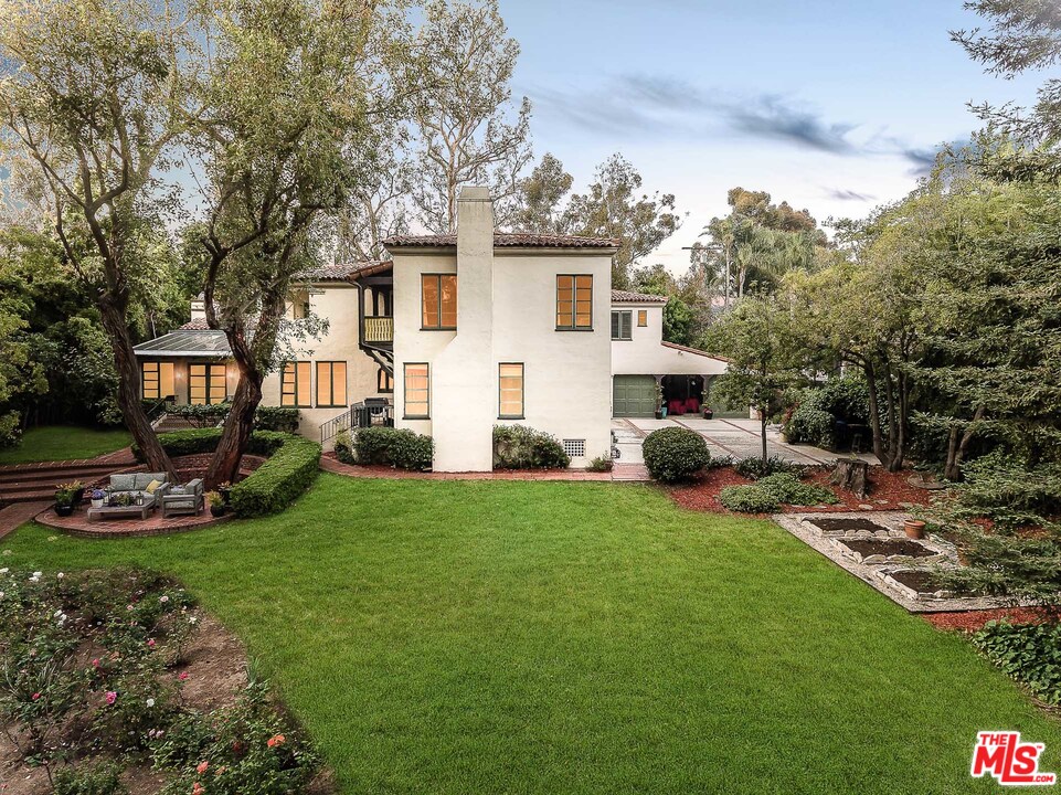 12730 Sunset Boulevard Los Angeles, CA 90049 - Photo 3 of 51 a view of a house with backyard sitting area and garden