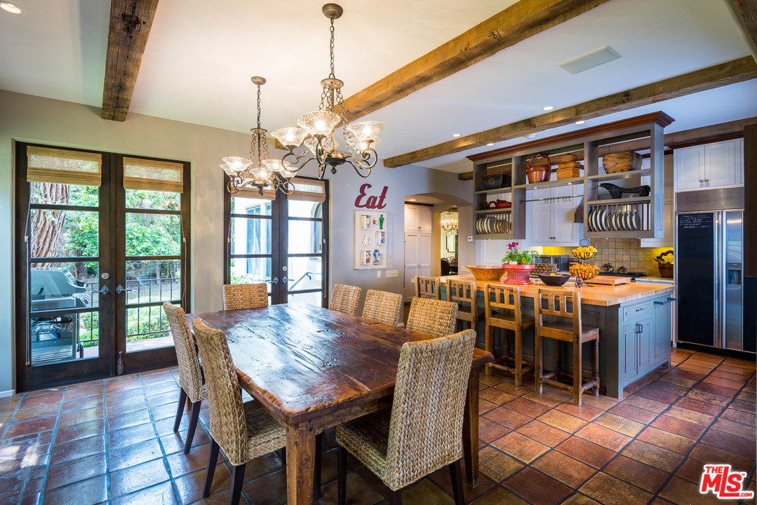 12730 Sunset Boulevard Los Angeles, CA 90049 - Photo 21 of 51 a view of a dining room with furniture window and wooden floor