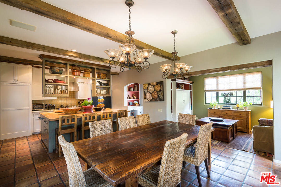 12730 Sunset Boulevard Los Angeles, CA 90049 - Photo 23 of 51 a view of a dining room with furniture window and wooden floor
