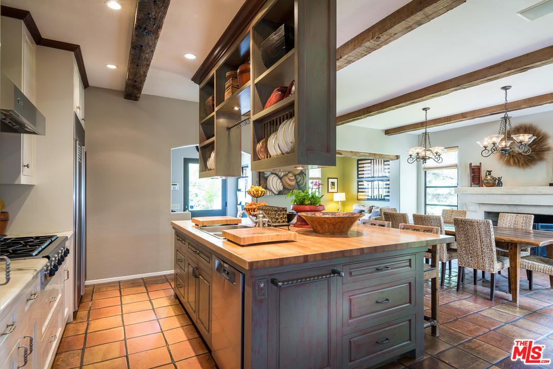 12730 Sunset Boulevard Los Angeles, CA 90049 - Photo 27 of 51 a kitchen with a sink stove and cabinets