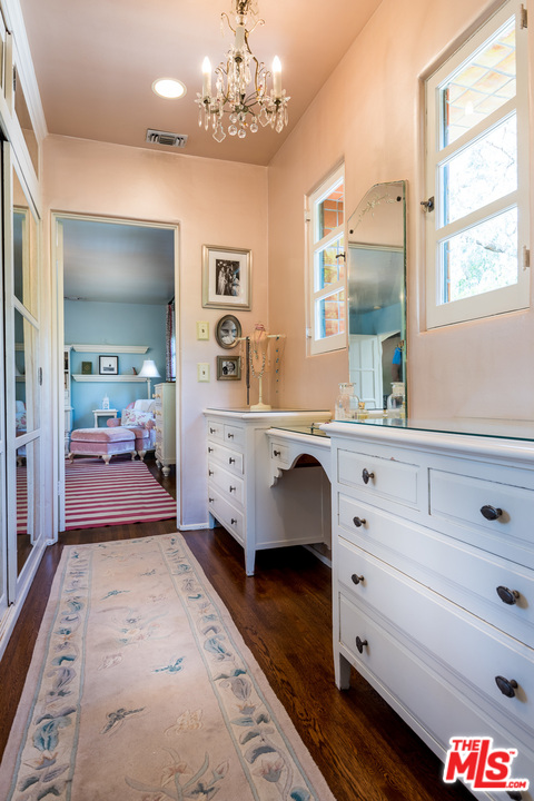 12730 Sunset Boulevard Los Angeles, CA 90049 - Photo 42 of 51 a bedroom with a bed and a dresser