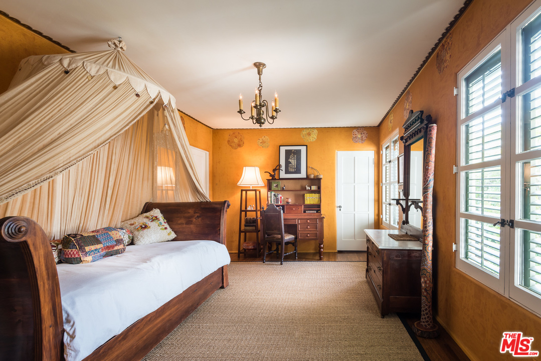 12730 Sunset Boulevard Los Angeles, CA 90049 - Photo 43 of 51 a bedroom with furniture and large windows