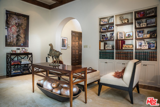 12730 Sunset Boulevard Los Angeles, CA 90049 - Photo 45 of 51 a living room with furniture a book shelf and a book shelf