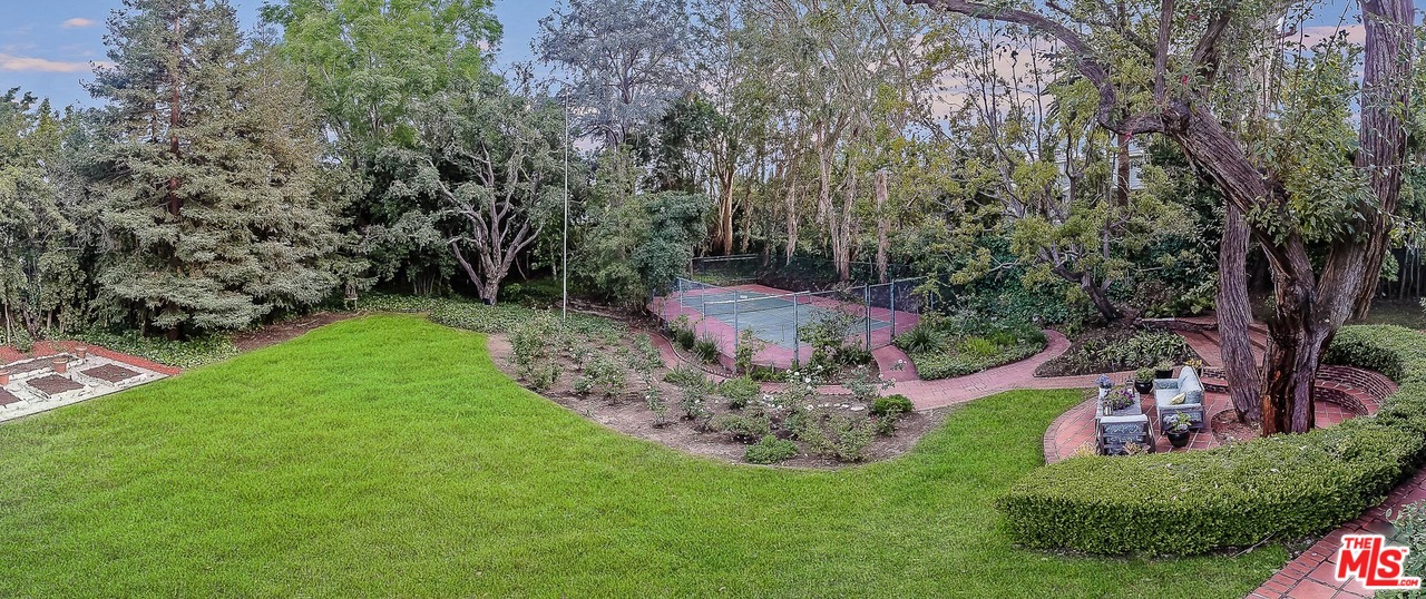 12730 Sunset Boulevard Los Angeles, CA 90049 - Photo 6 of 51 a view of a garden with a tree