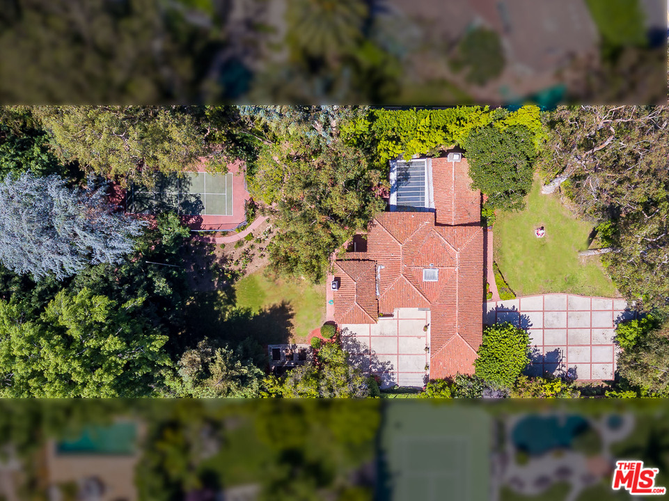 12730 Sunset Boulevard Los Angeles, CA 90049 - Photo 9 of 51 an aerial view of a house with a garden and lake view