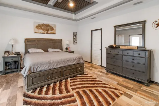 a bedroom with a bed and a dresser