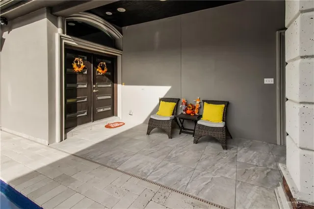 a view of living room with furniture and a gate