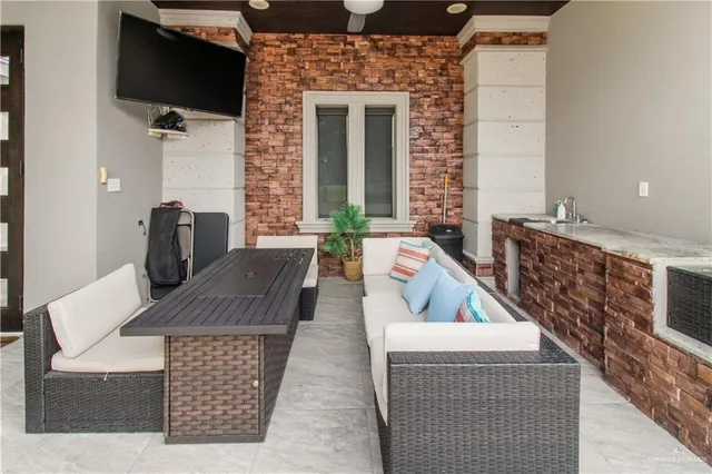 a living room with furniture and flat screen tv