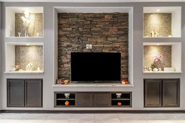 a living room with a fireplace and a window