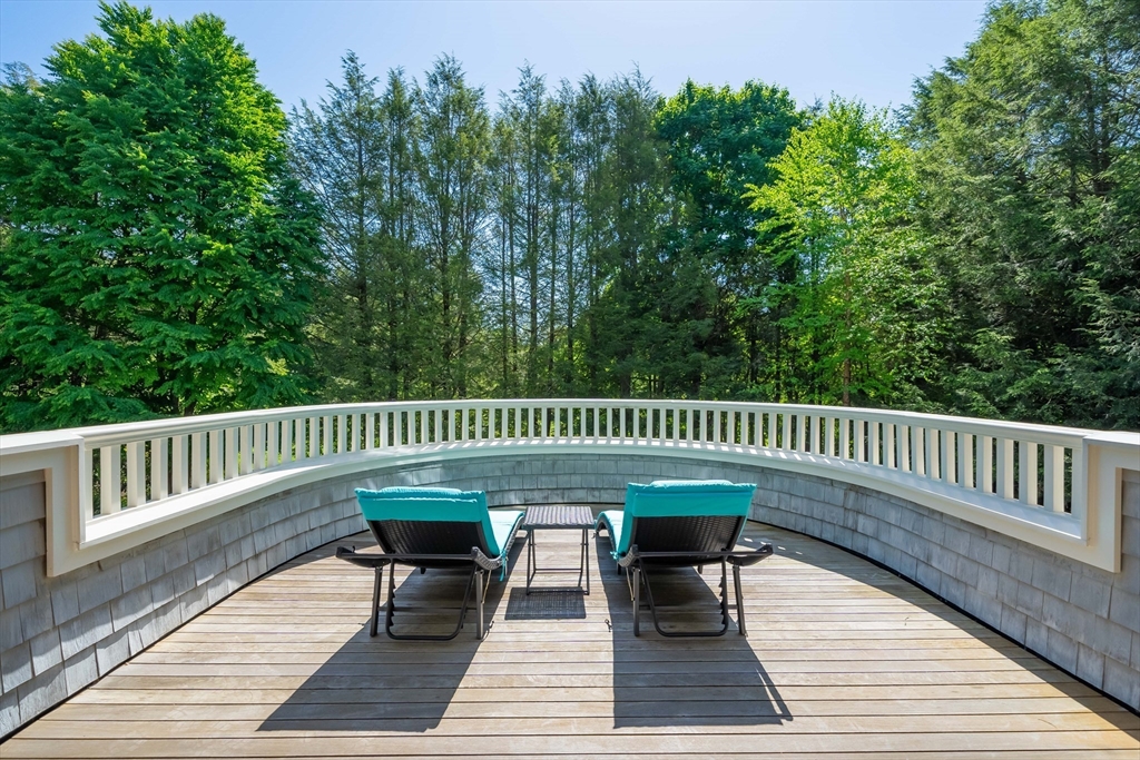 197 Grant Street Lexington, MA 02420 - Photo 20 of 42 a view of a wooden deck with furniture